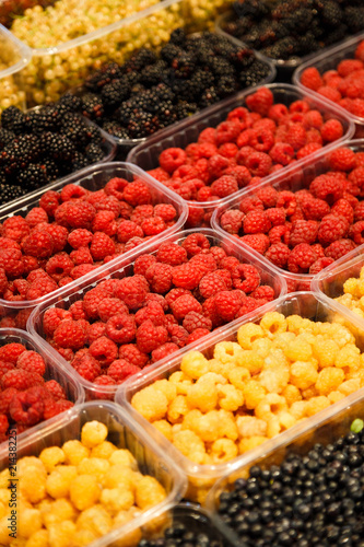 Colourful mix of different fresh berries at market © Iryna Budanova