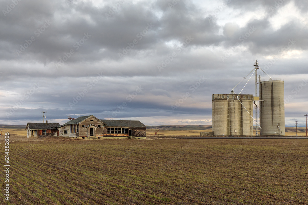 Abandoned Farm Buildings Near Grain Elevator in eastern Washington Abandoned Farm Buildings Near Grain Elevator in eastern Washington