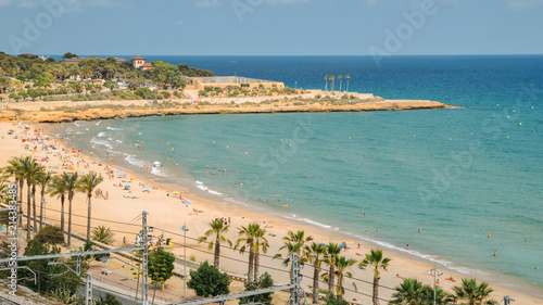 Sunbathers at Miracle Beach in Tarragona  Spain