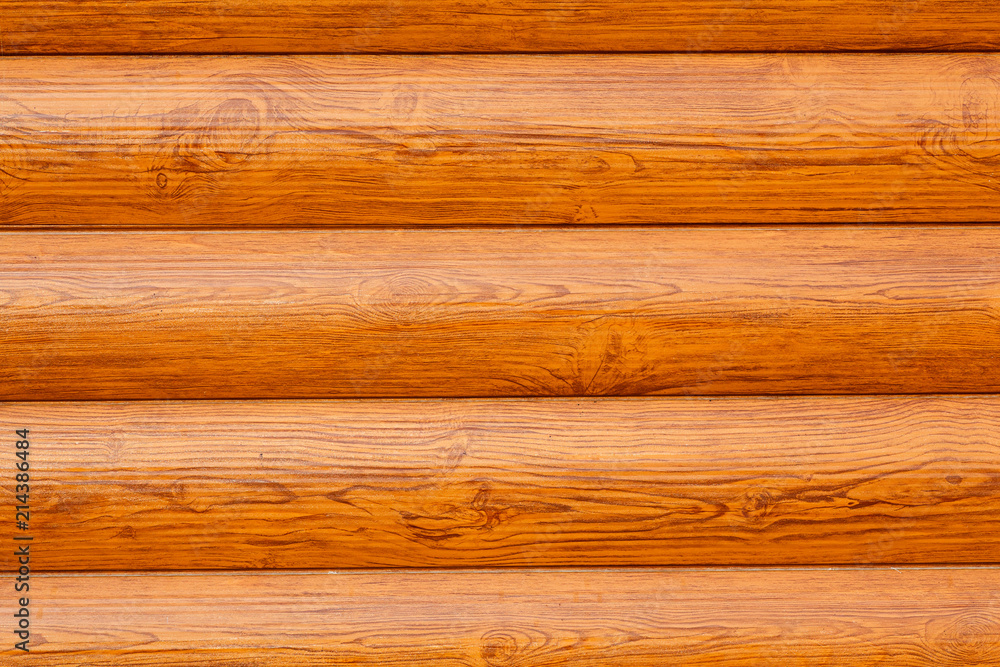 Wall of a log house with texture and wood knots exterior. Backgroud texture Wall of a log house with texture and wood knots exterior. Backgroud texture