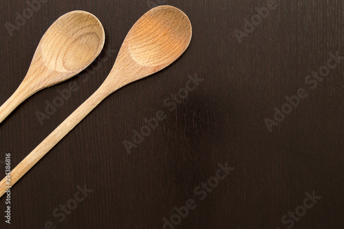 Wooden spoons on black table