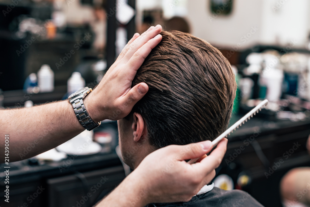 Fototapeta premium Men's haircut and styling in barbershop. Stylish Haircut Haircut.