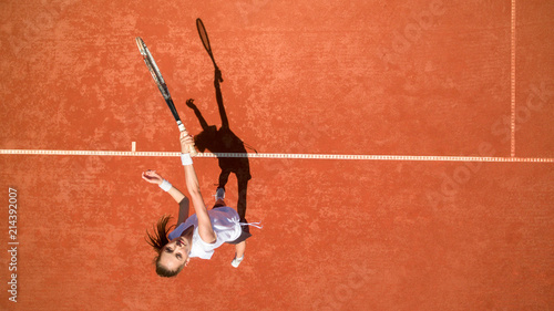 Top view of female tennis player on tennis court © luckybusiness