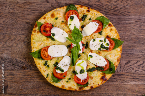 Pizza Caprese with basil