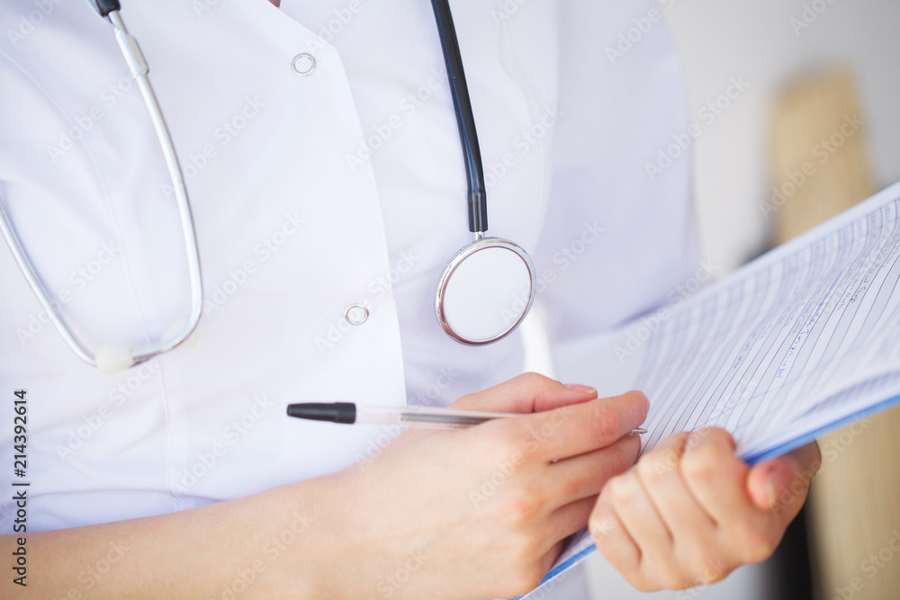 Doctor Woman With Stethoscope In Hospital. Concept Of The Global Healthcare And Medicine Doctor Woman With Stethoscope In Hospital. Concept Of The Global Healthcare And Medicine