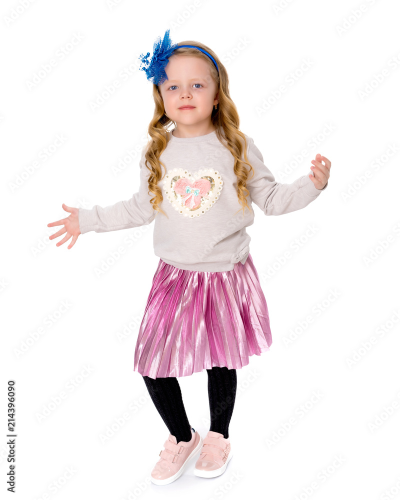 A cheerful little girl is dancing. A cheerful little girl is dancing.