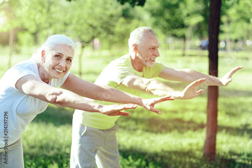 Looking delighted. Amazing sunny day of two enthusiastic energetic pensioners in a lovely park