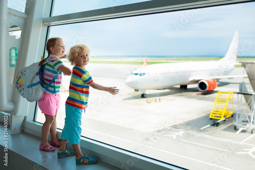 Kids travel and fly. Child at airplane in airport