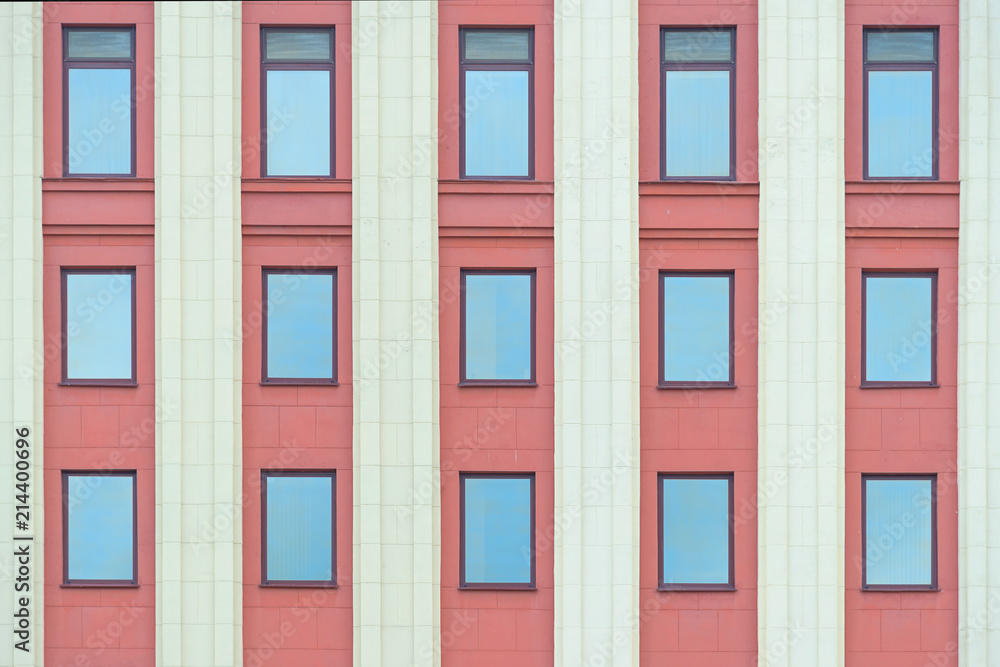 Colourful red fasade wall with columns and windows texture Colourful red fasade wall with columns and windows texture