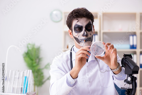 Scary monster doctor working in lab photo