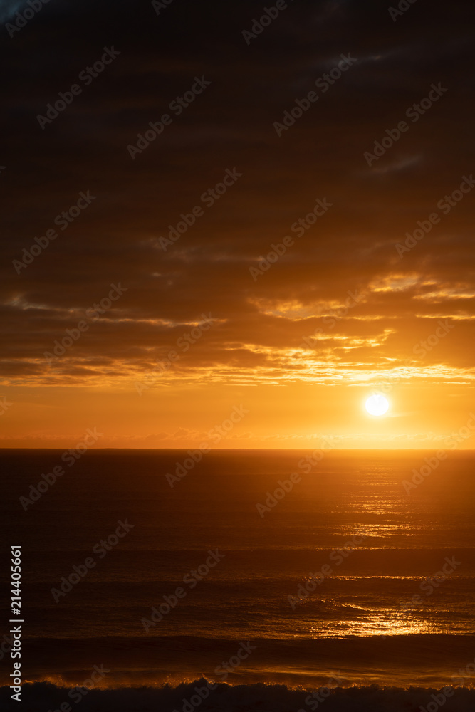 Brilliant golden sunrise over ocean