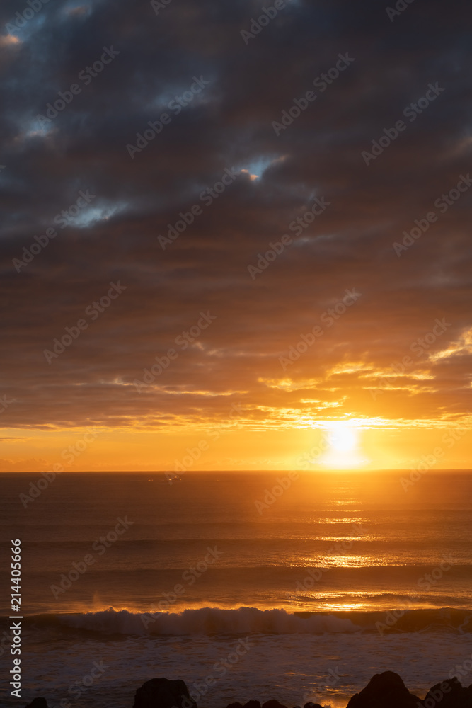Brilliant golden sunrise over ocean