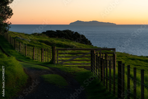 Ocean sunrise and lower slopes of Mount Maunganui