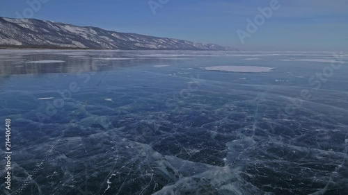 Wallpaper Mural Family is ice skating at day. Girls to ride figure ice skates in nature. Mother and daughter riding together on ice in cracks. Outdoor winter fun for athlete nice winter weather. People on ice skates Torontodigital.ca