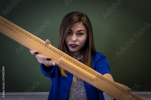 The teacher is in the classroom. The student in the office