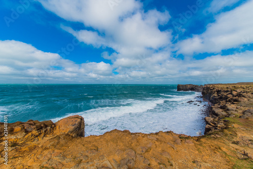 Cliff with ocean and blue sky