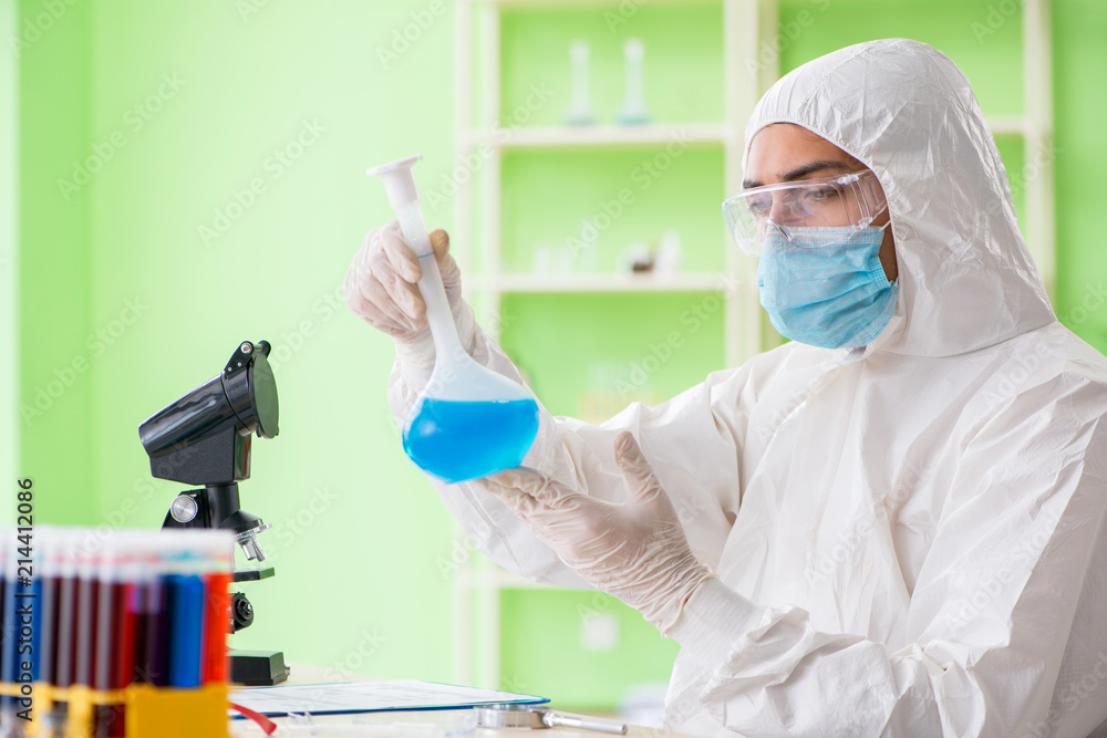 Chemist working in the lab on new experiment Chemist working in the lab on new experiment