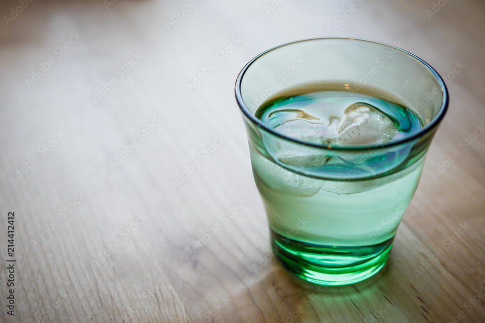 Water in modern glass with cube ice. Water in modern glass with cube ice.