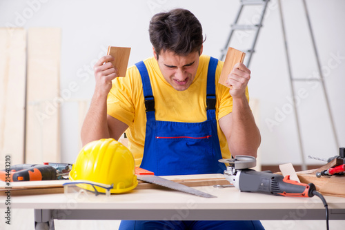 Floor repairman disappointed with his work 