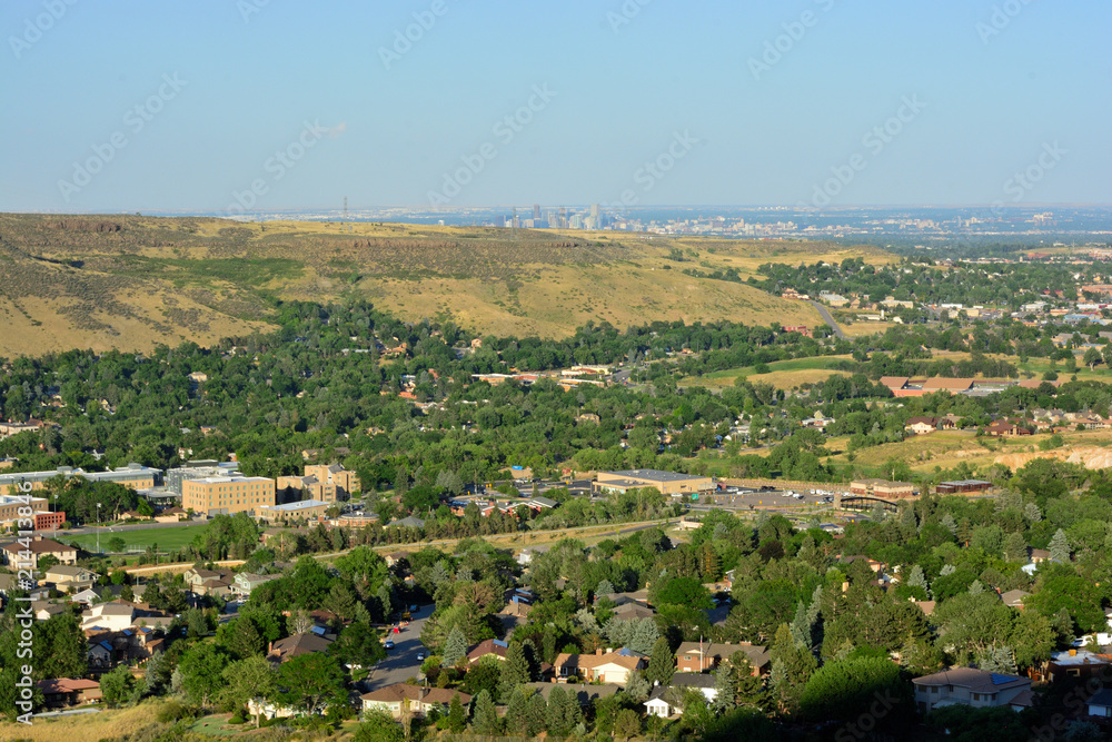Golden, Colorado on a sunny day with the Denver skyline in the background.