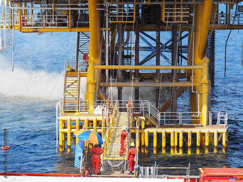 Cement dust from jack up rig is blown near platform sea deck.