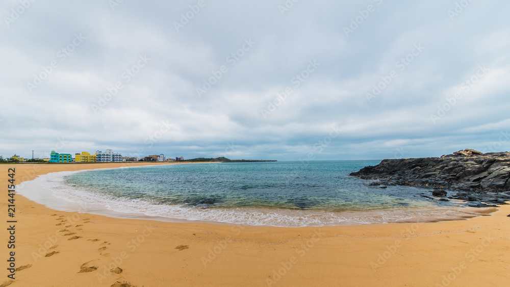 Sandy beach with ocean and clouds in Shanshui, Penghu, Taiwan