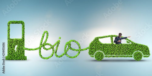 Businessman with car powered with biofuel photo