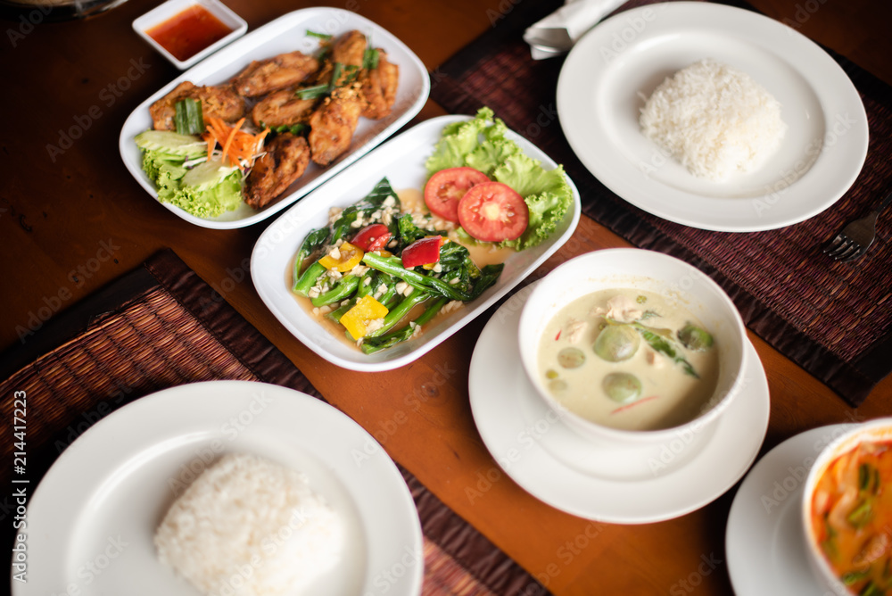 Dinner set of local Thai style with assorted fried vegetable and hot soup, chicken grill and curry hot chilli, rice main menu Dinner set of local Thai style with assorted fried vegetable and hot soup, chicken grill and curry hot chilli, rice main menu