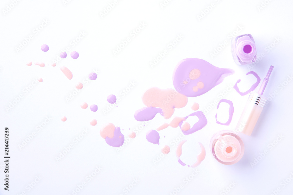 Drops and blobs from spilled nail polish on a white background Drops and blobs from spilled nail polish on a white background