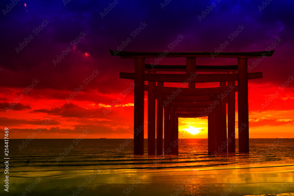 silhouette torii wooden Japanese pillar stand on over the sea and sunset sky silhouette torii wooden Japanese pillar stand on over the sea and sunset sky