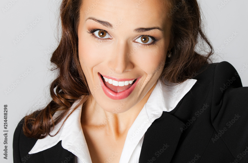 Happy business woman, over gray Happy business woman, over gray
