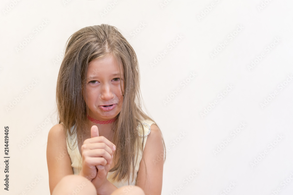 The little girl is sincerely crying. The concept of child insult, depression and misunderstanding The little girl is sincerely crying. The concept of child insult, depression and misunderstanding