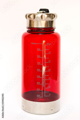 Red bottle scale measuring the volume of water isolated on white background