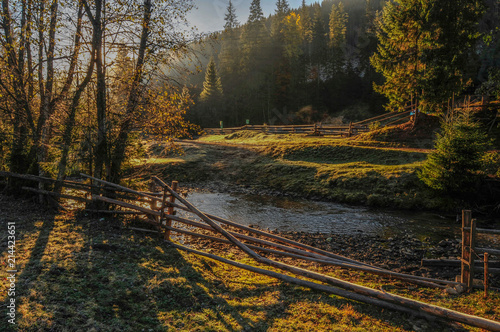 Autumn in Carpathians  river under the sunset