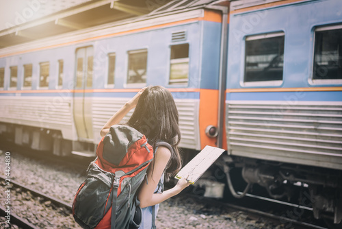 Asian woman traveler has waiting the train at Hua Lamphong station at Bangkok, Thailand. photo