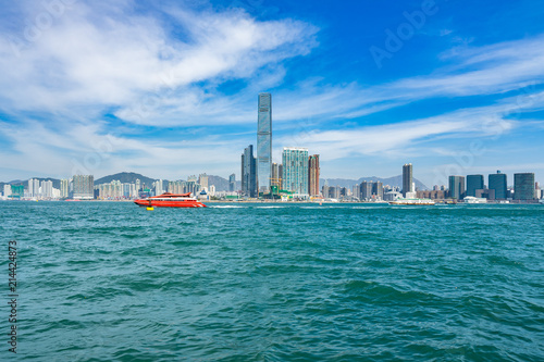 Photography An hydrofoil to Macau with the International Commerce Centre in the background,