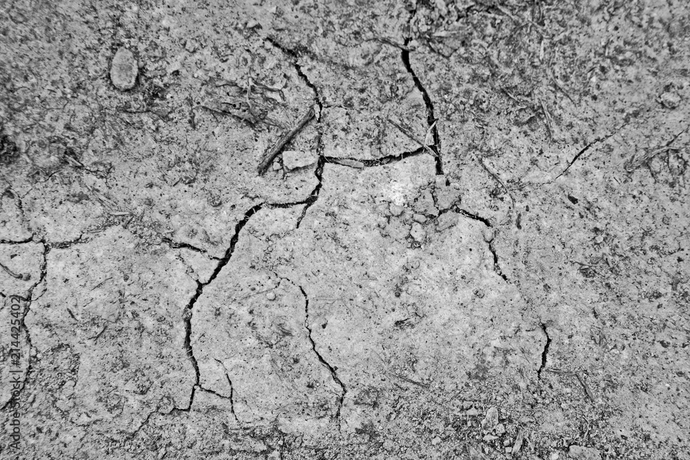 Obraz premium Dry soil in cracks from above