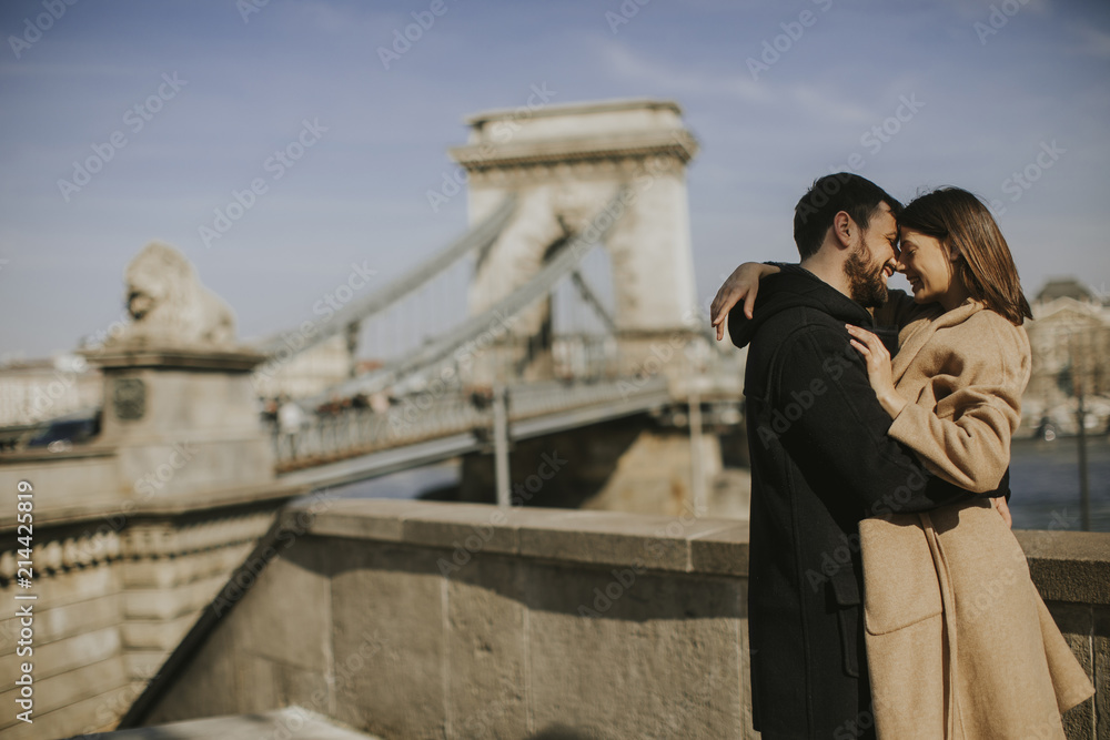 Couple in love hugging with magnificent view of Budapest, Hungary Couple in love hugging with magnificent view of Budapest, Hungary