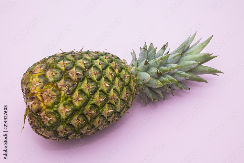 tropical summer fruit, pineapple on pink background tropical summer fruit, pineapple on pink background