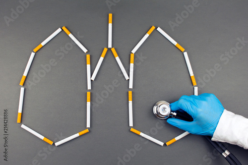 Cigarette smoker's lungs, doctor's hand Lung Cancer. addicted nicotine problems Concept