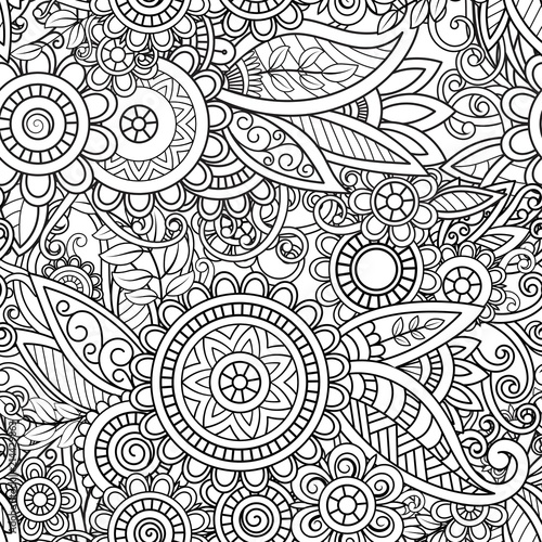 Ethnic seamless pattern with mandalas, flowers and leaves. Doodles floral black and white ornament. Perfect for wallpaper, adult coloring books, web page background, surface textures.