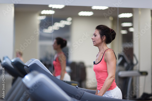 middle age woman running in sports club