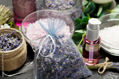 Aromatic composition of lavender  herbs  cosmetics and salt on a dark table top