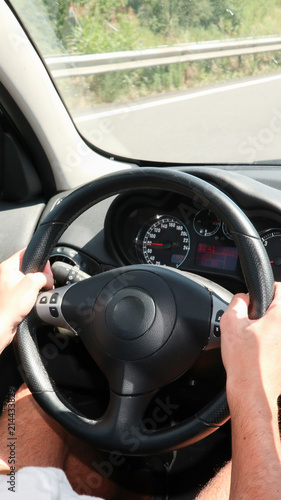 Driver hands man woman on the steering wheel inside car © OceanProd