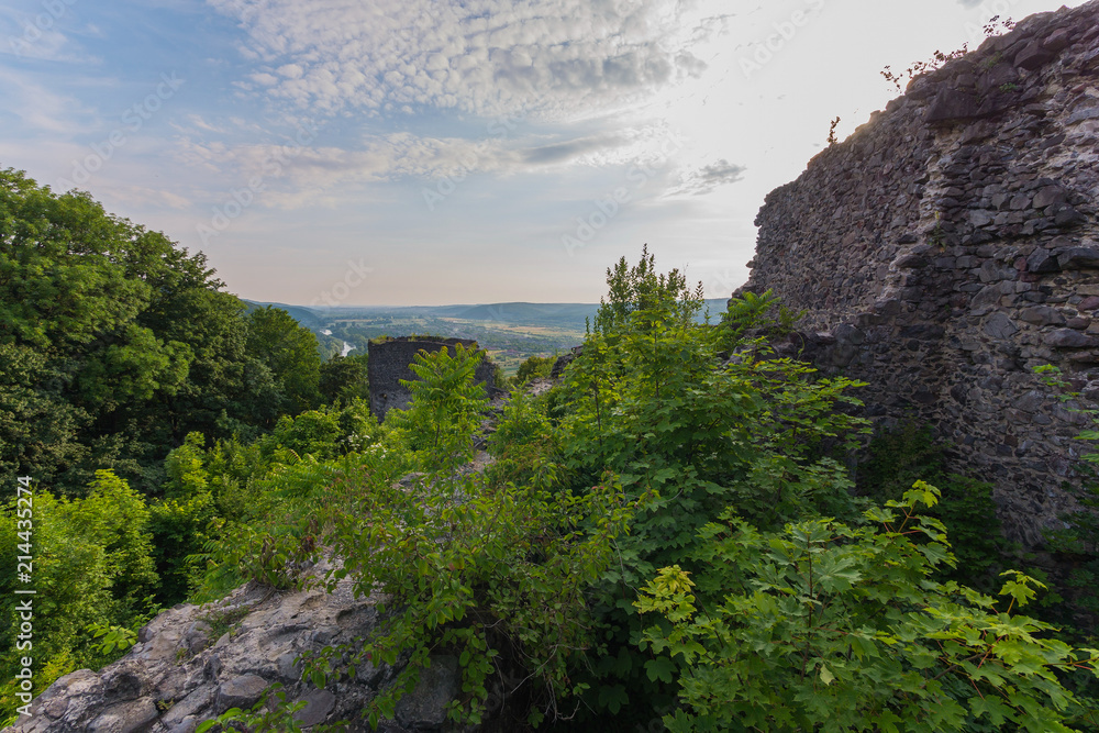 a view of the stone wall of the fortress on a cloudy day