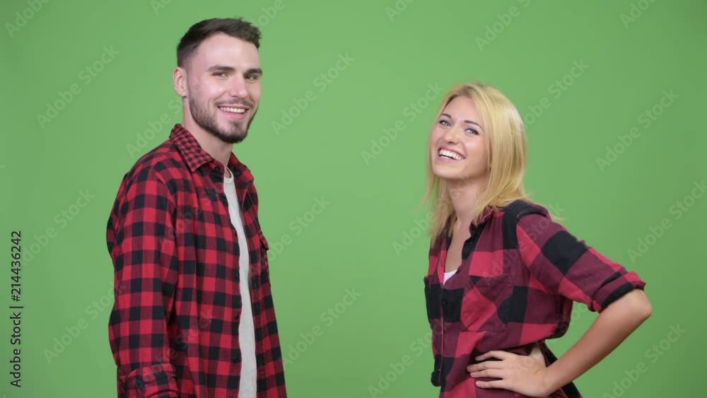 Young couple celebrating with high-five together Young couple celebrating with high-five together