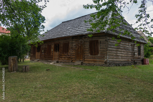 wooden old house with shutters in the museum of folk architecture and everyday life. Uzhhorod Ukraine photo