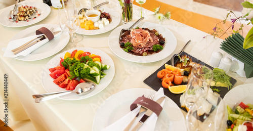 Table setting, dishes. Appetizers on skewers, desserts. Salads. Snacks. Buffet. meat salad