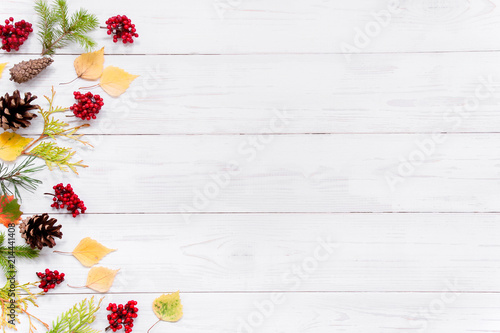 White textured wooden background with autumn decoration