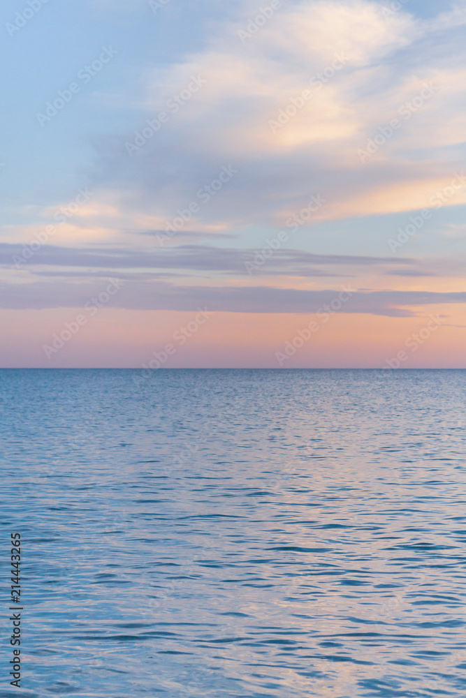 Beautiful summer sunset with clouds over the sea